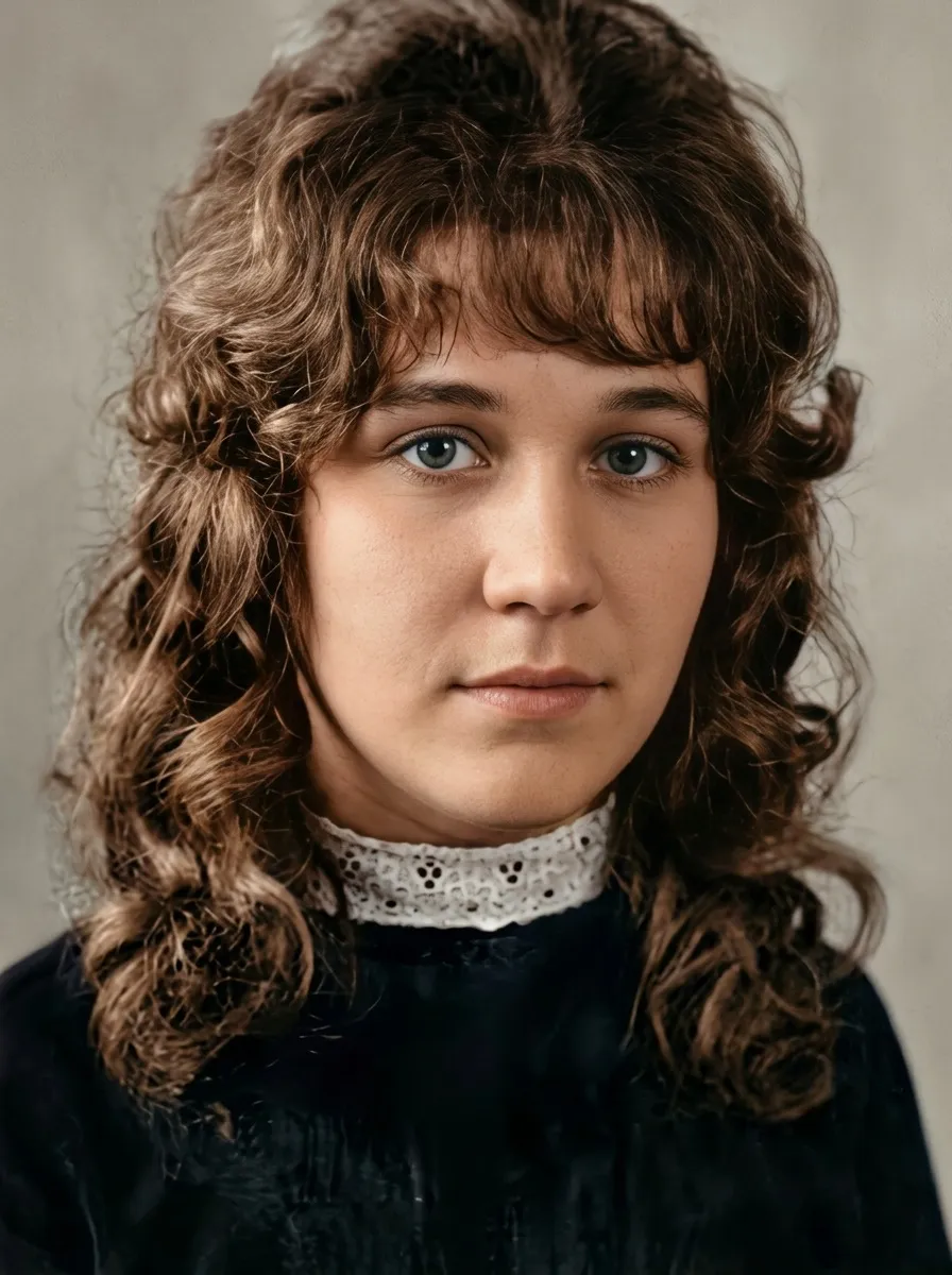 The same portrait restored and in colour — the cracks gone, her face unchanged
