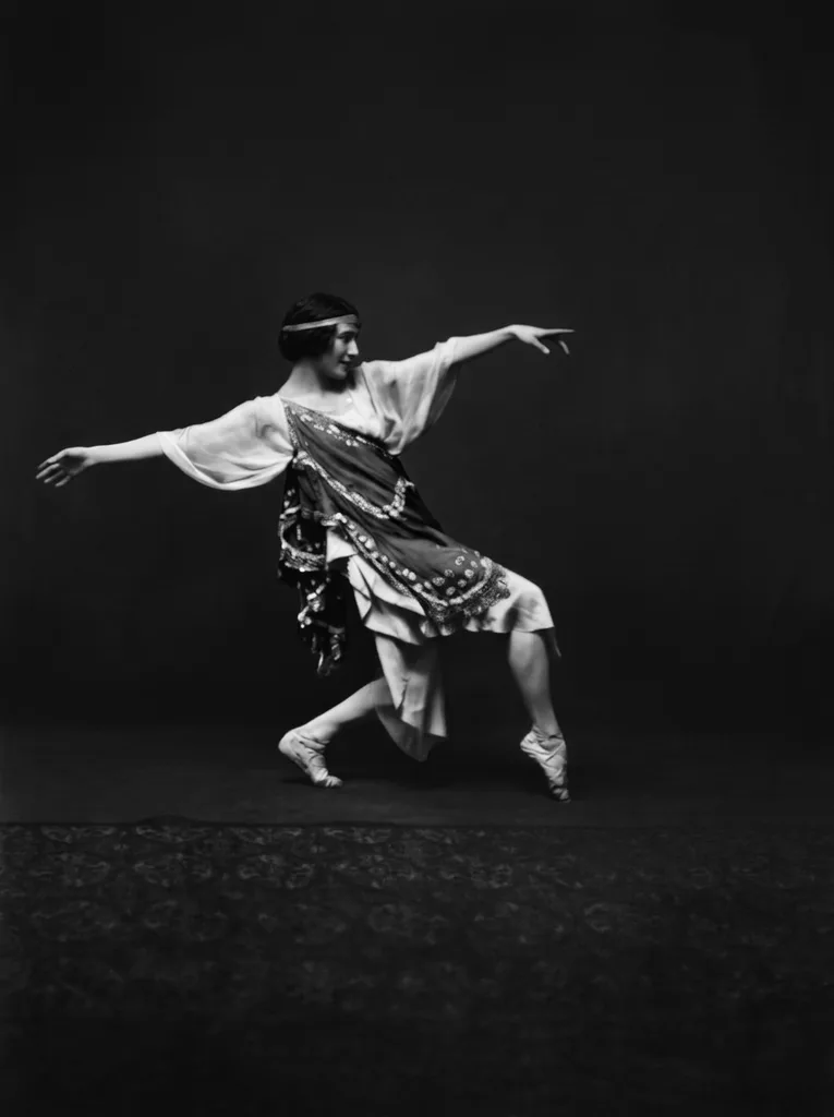 The same photograph after restoration — the mirroring lifted, Pavlova's pale costume and the dark studio floor readable again
