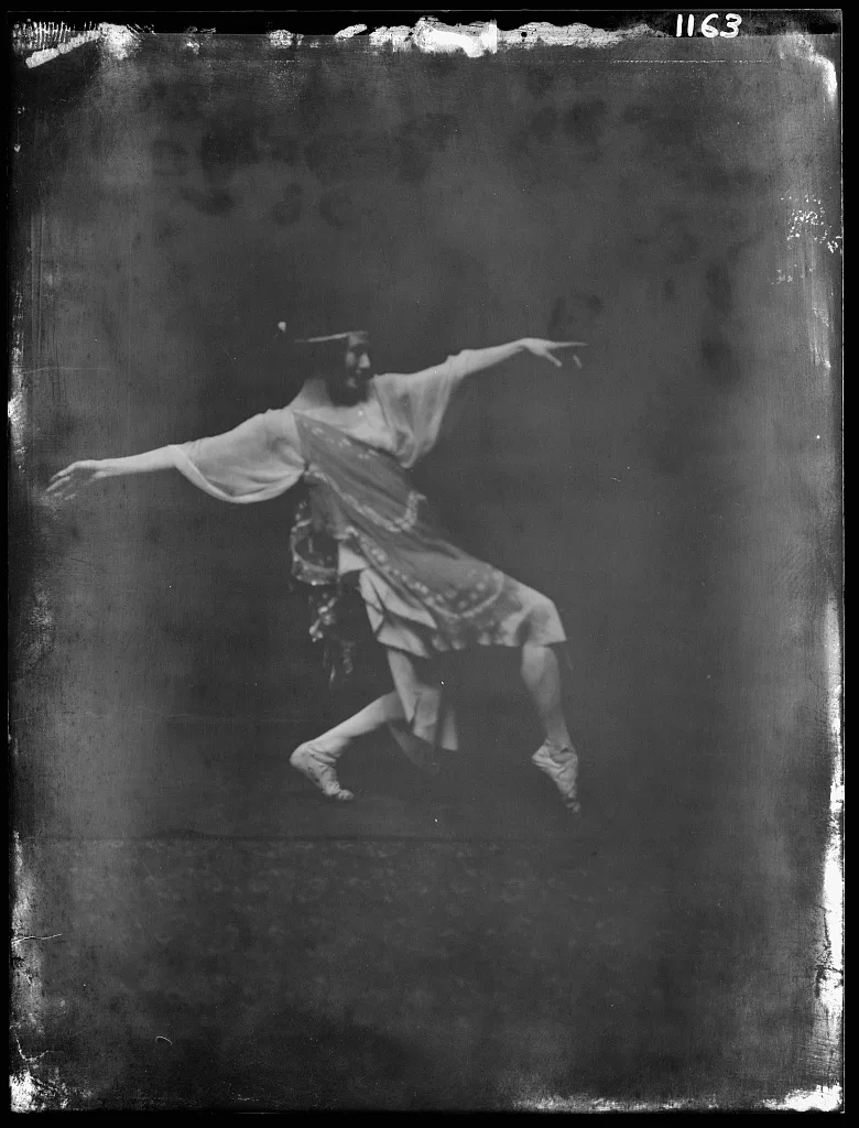 Anna Pavlova photographed by Arnold Genthe in 1915, before restoration — the nitrate negative veiled by silver mirroring and stained at the edges