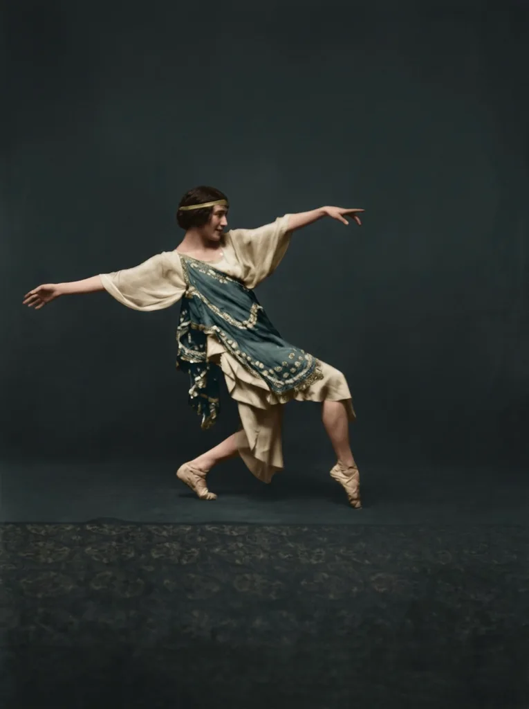 An experimental colour version of the same photograph, with the tunic's colour inferred from tone and context rather than recovered from the negative