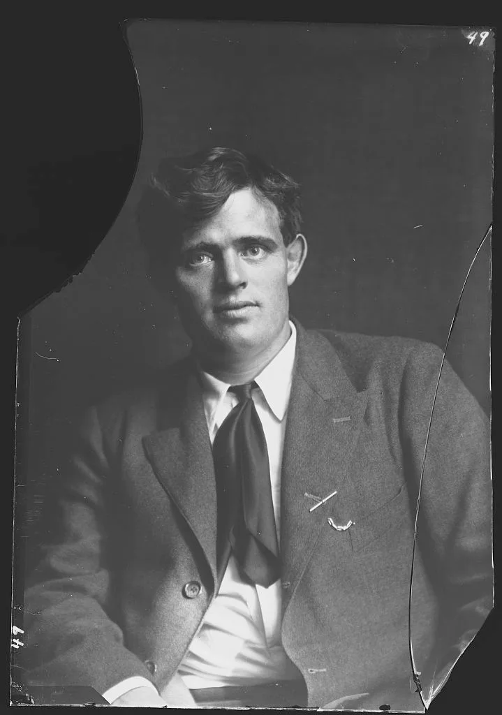 Jack London photographed by Arnold Genthe, before restoration — the glass negative with its upper-left corner broken away and a crack down the right edge
